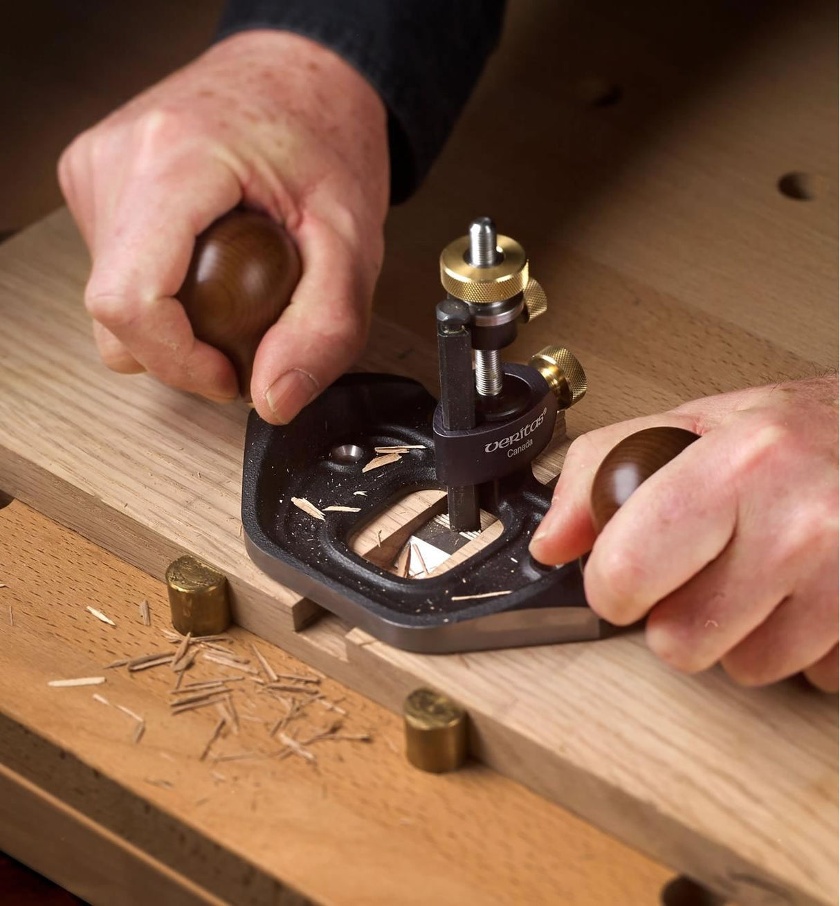 Woodworker using the Veritas Router Plane
