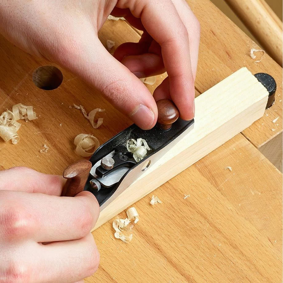 Woodworker planing timber with the Veritas Miniature Bevel-Up Jack Plane