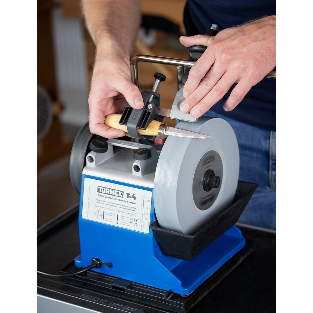 Tormek T-4 Sharpening System being used to sharpen Mora Carving Knife.