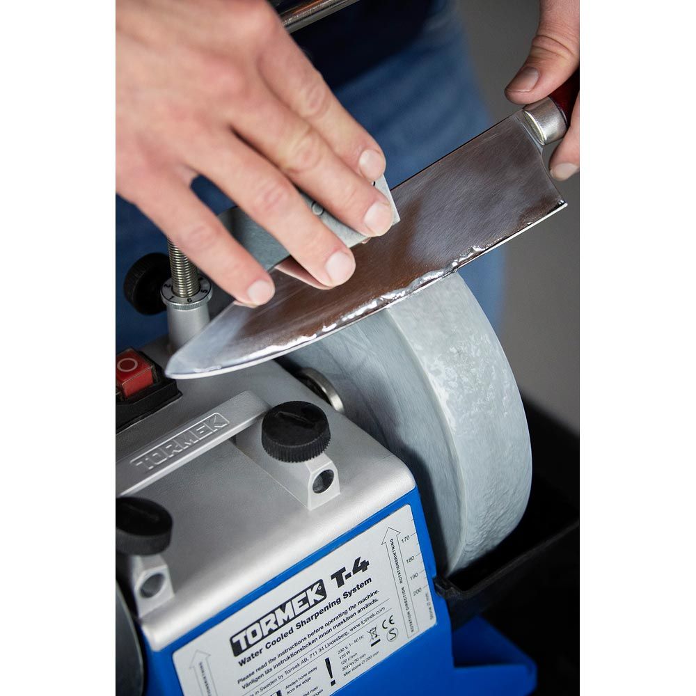 Tormek T-4 Sharpening System being used to sharpen kitchen knife.