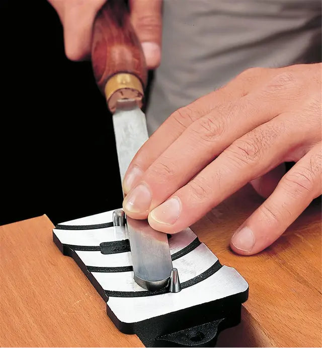 Veritas Scraper Burnisher being used by a woodturner to set his round turning scraper.