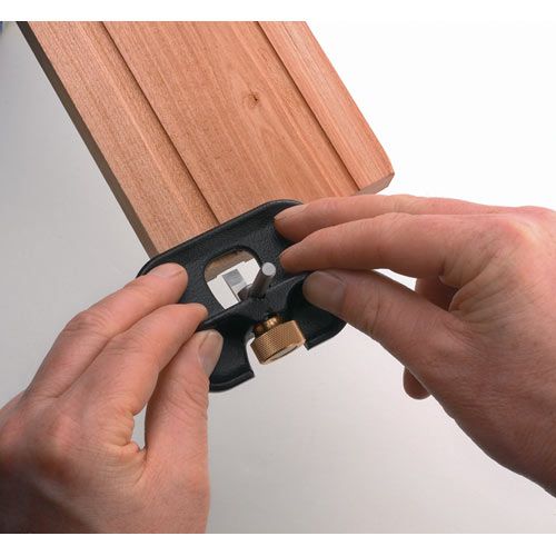 Woodworker cutting groove into timber with the Veritas Small Router Plane