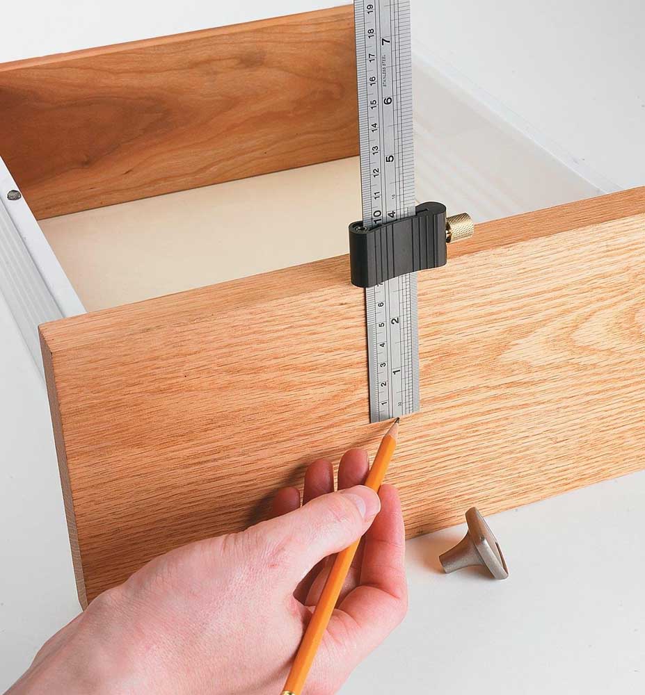 Veritas Ruler Stop being used to mark wooden draw front.