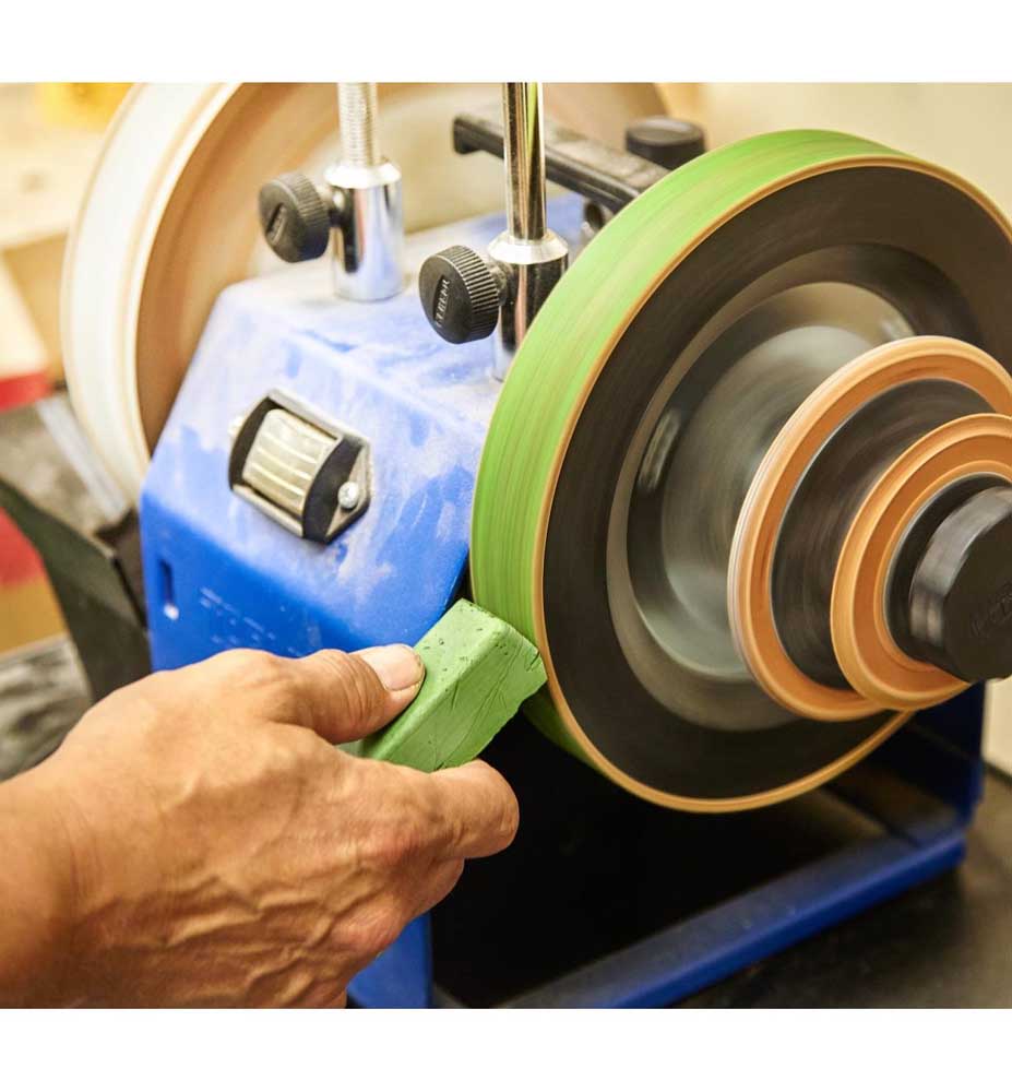 User applying Veritas Honing Compound to Tormek sharpening wheel