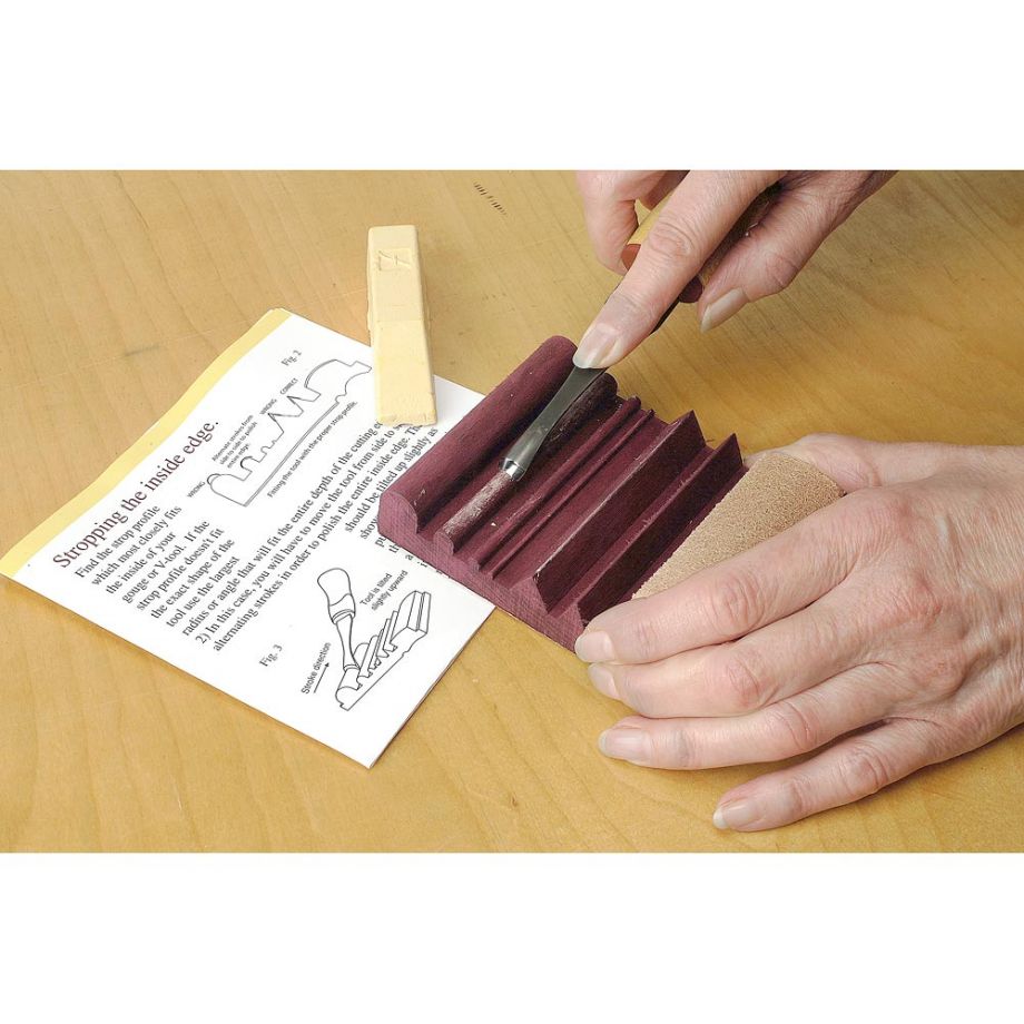 Woodworker using the Flexcut SlipStrop with Sharpening Compound to sharpen their carving tool
