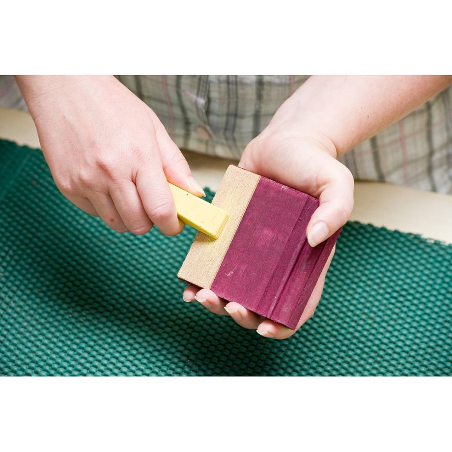Woodworker applying Sharpening Compound to Flexcut SlipStrop