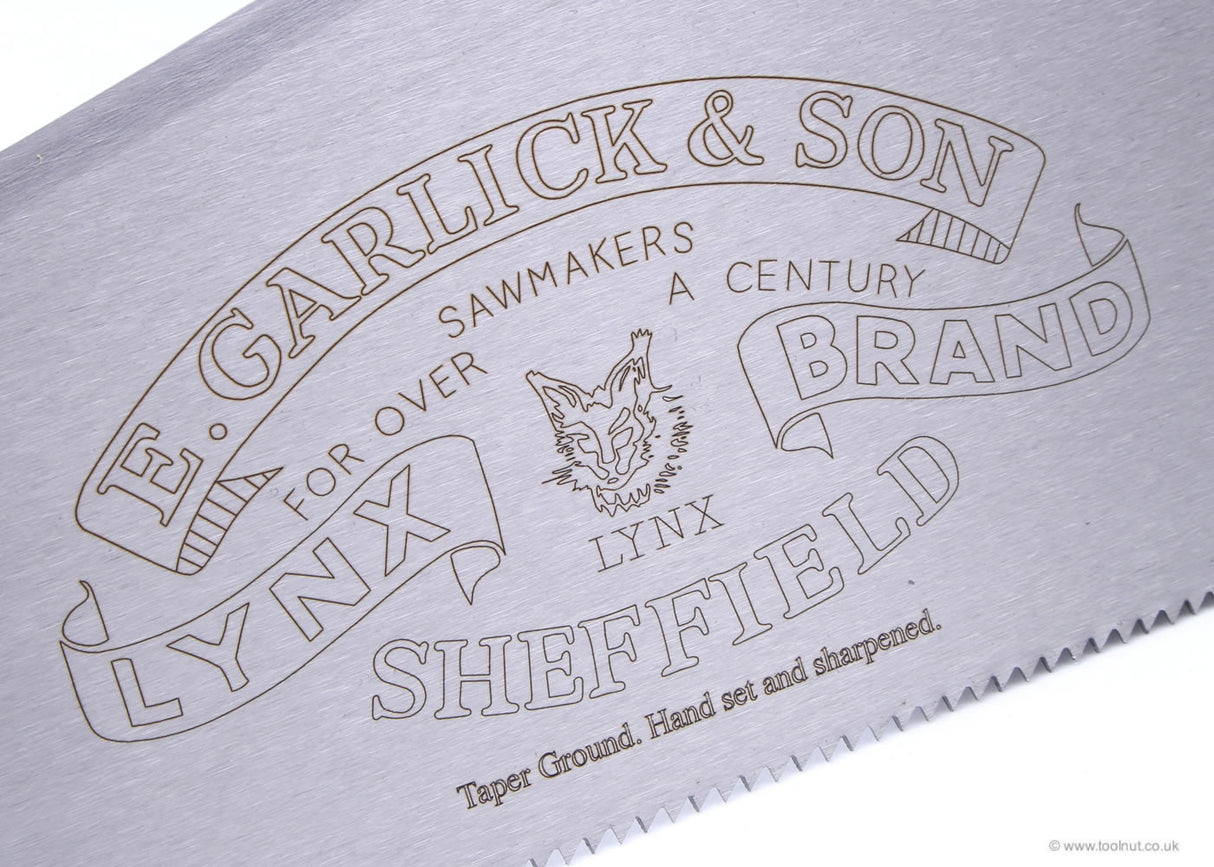 Close up view of saw blade with E.Garlick & Son branding