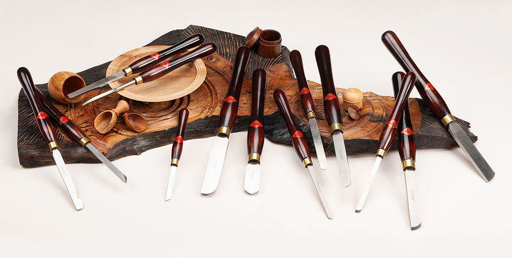 Henry Taylor Woodurning Tools displayed next to turned bowls, pots..