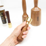 Narex Brass head Carving mallet held in hand with three other sizes shown for comparison