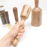 Narex Small wooden Carving mallet held in hand with three other sizes shown for comparison
