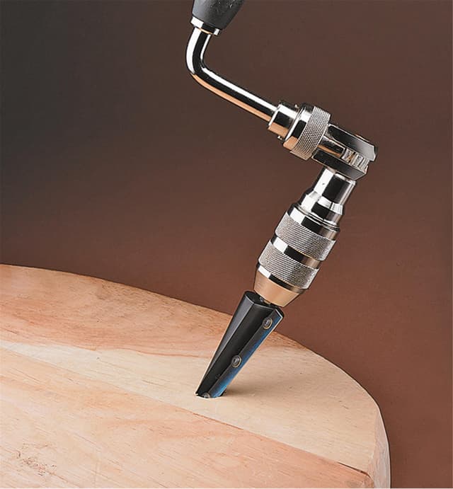 Ratchet Brace and Veritas Pro Taper Reamer being used to drill into a chair base.