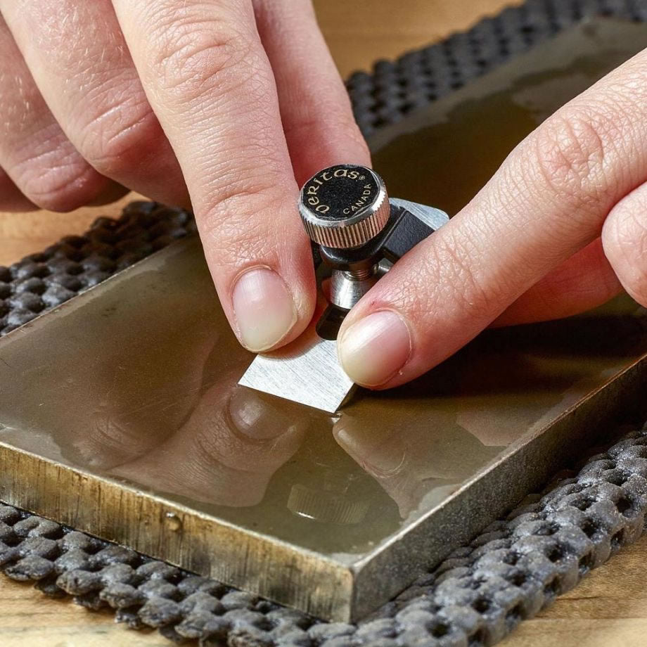 Miniature Honing Guide being used to sharpen miniature tools