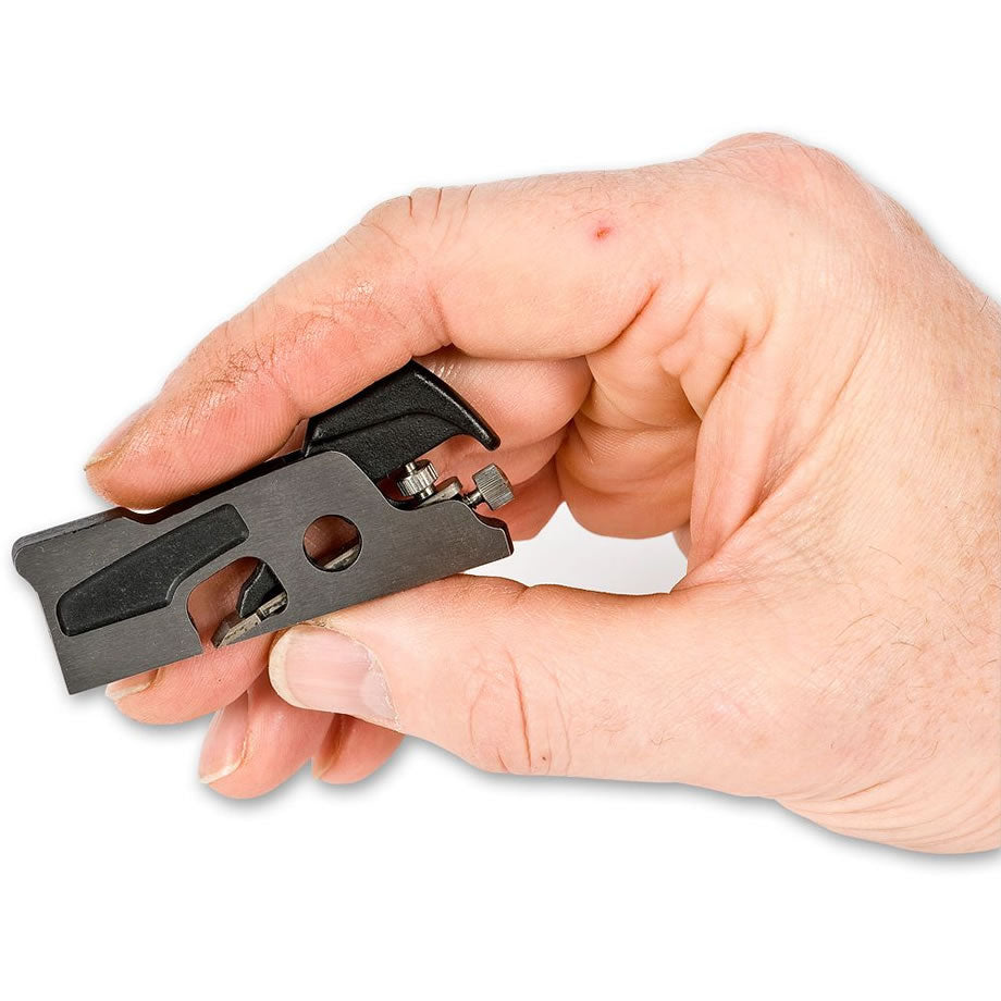 Woodworker holding a Veritas Miniature Shoulder Plane