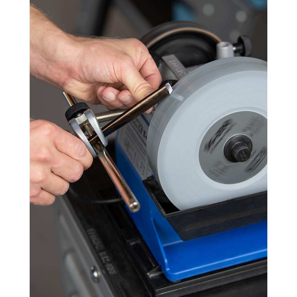 Tormek T-4 Sharpening System being used to sharpen carving gouge.