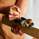 Woodworker using the Veritas No.1 Bevel-Up Bench Plane to plane timber