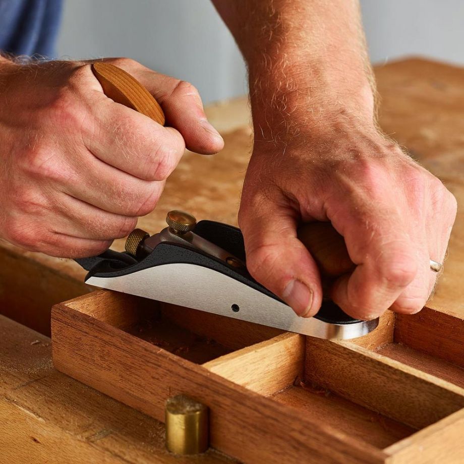 Woodworker using the Veritas No.1 Bevel-Up Bench Plane to plane workpiece