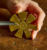 Woodworker checking the bevel angle of a chisel using the Veritas Bevel Measuring Tool.