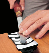 Veritas Scraper Burnisher being used by a  woodturner to set his round turning scraper.