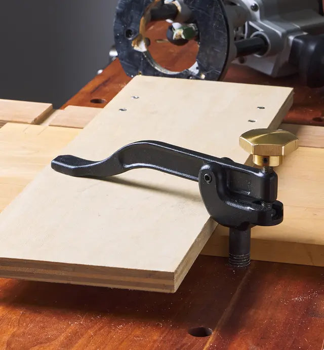 Veritas Woodworking holddown tool clamping a piece of wood on a workbench