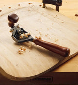 Veritas Pullshave being used to shape a chair seat.