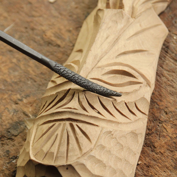 Riffler in use on wood carving