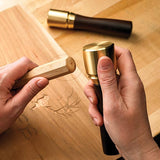 Woodcarver striking chisel with his Veritas Journeymans Brass Mallet