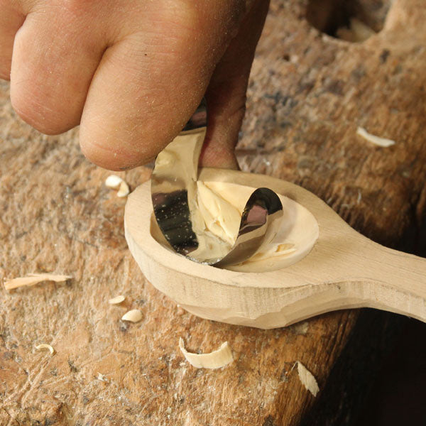 Narex Carving Hook Knife being used to carve out spoon
