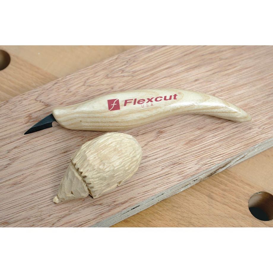 Flexcut Detail Knife next to hedgehog woodcarving