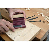 Woodcarver using the Flexcut SlipStrop with Sharpening Compound to sharpen their carving tool
