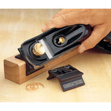 View of the Veritas Low Angle Block Plane being used with chamfer attachment to chamfer a piece of timber