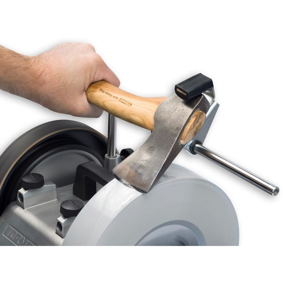 Axe blade being sharpened with aid of the Tormek Axe Grinding Jig - SVA-170